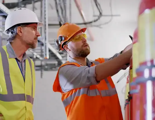men completing fire inspection